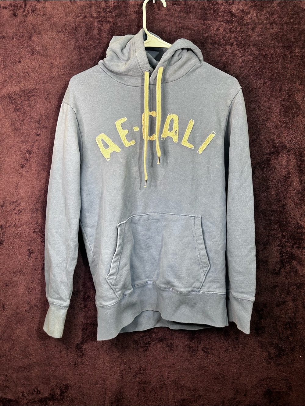 American Eagle Outfitters Light Blue Hoodie with Yellow Accents